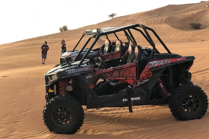 Experience the thrill of a dune buggy ride across Dubai's stunning red sand dunes. Feel the excitement as you navigate the vast desert terrain and create unforgettable memories.